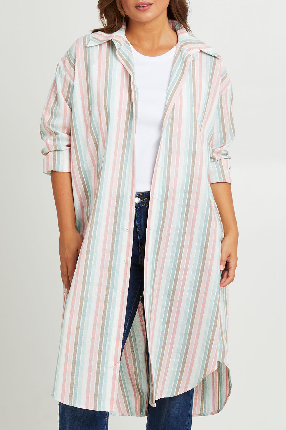 Model Monique wearing size 14 of the Happy Times Tunic Shirt in colour Stripe (Blue), from the front, cropped image