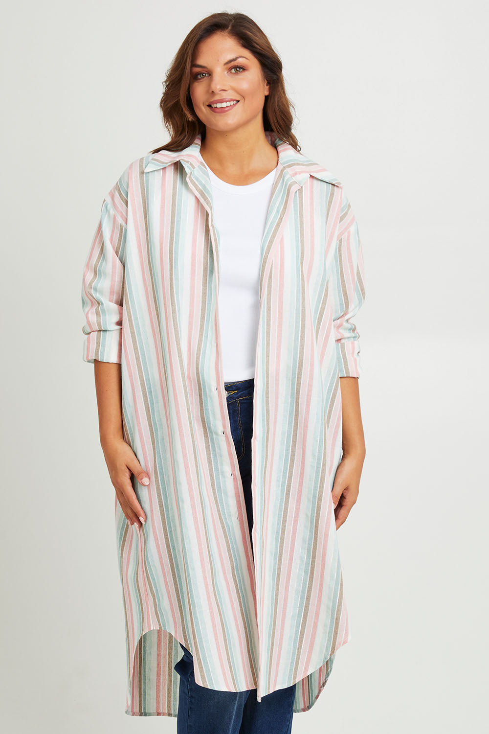 Model Monique wearing size 14 of the Happy Times Tunic Shirt in colour Stripe (Blue), from the front, cropped image