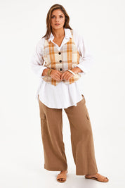 Model Monique wearing size 14 of the Ready And Able Checked Vest in colour Check, from the front, showing the whole outfit