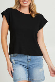 Model Grace wearing size 10 of the Coffee Run Skirt Set in colour Black (Black), from the front, cropped image