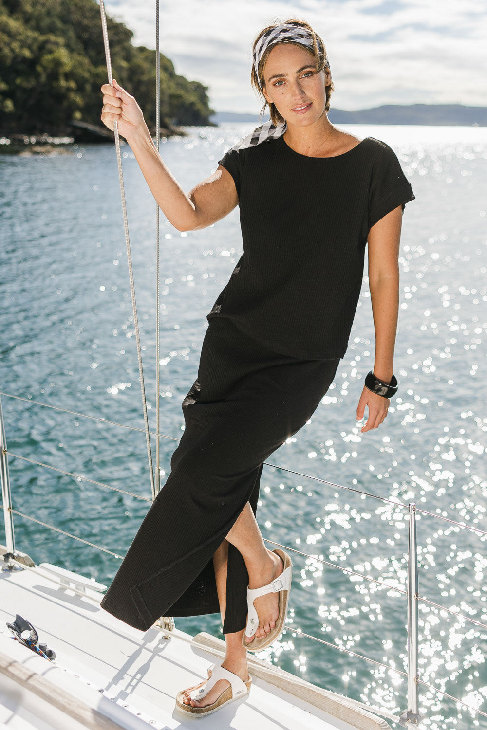 Model Tegan wearing size 10 of the Coffee Run Skirt Set in colour Black (Black), from the front, showing the whole outfit