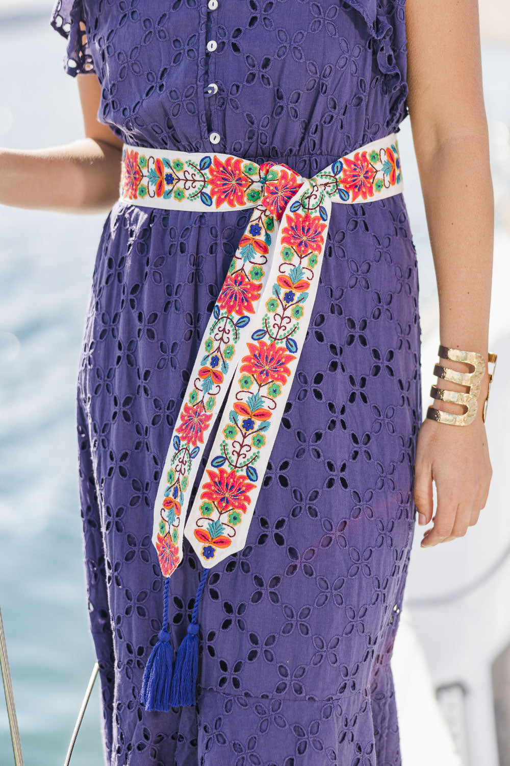 Model Tegan wearing size S-M of the Finishing Touch Embroidered Belt in colour Bright, from the front, showing the whole outfit