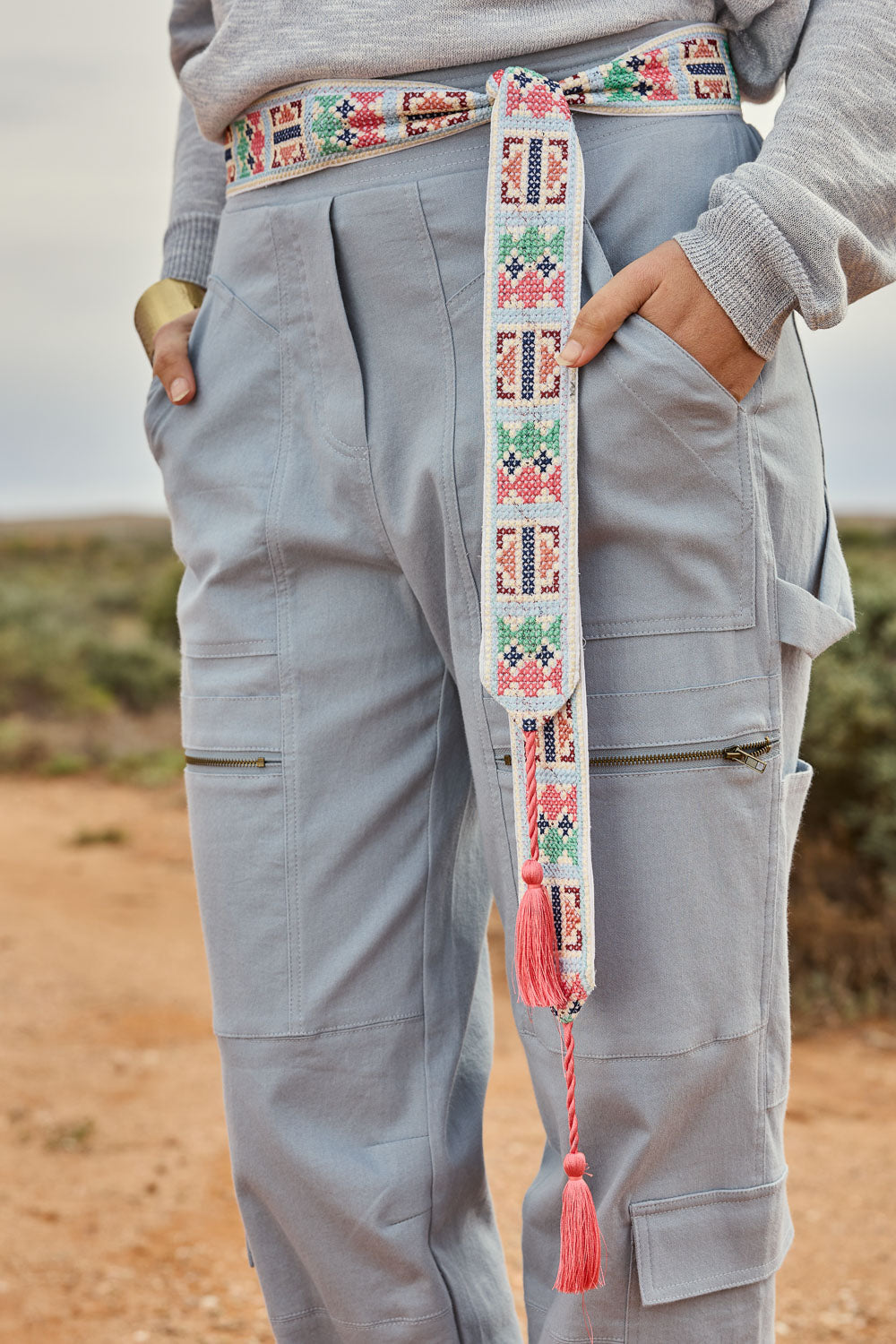 Model Tegan wearing size S-M of the Finishing Touch Embroidered Belt in colour Geopale (Blue), from the front, showing the whole outfit