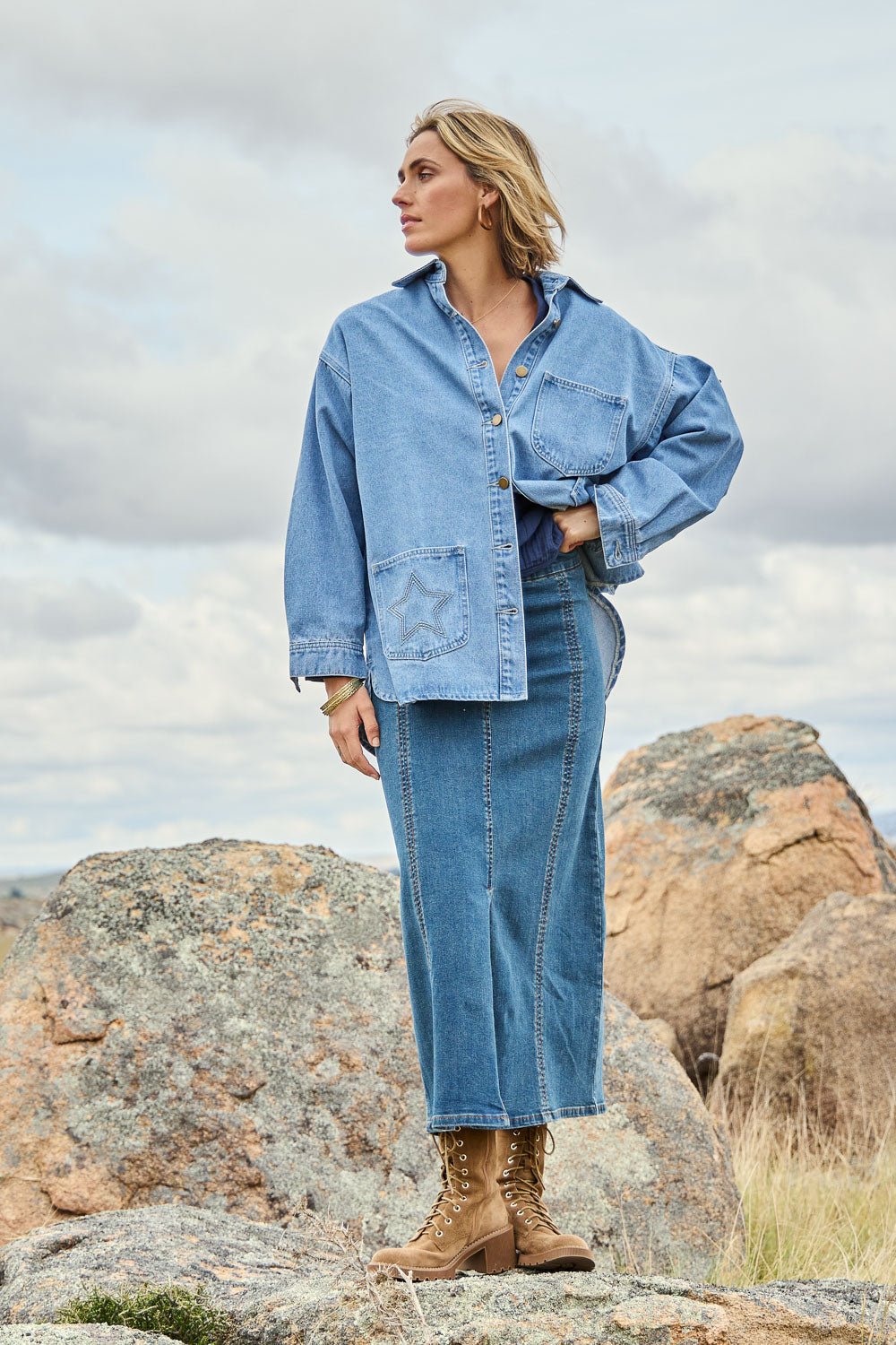 Model Tegan wearing size 10 of the Easy As Pull On Panel Skirt in colour Darkdenim (Blue), from the front, showing the whole outfit