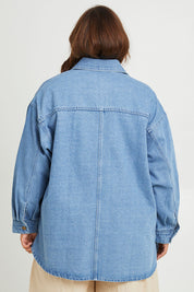 Model Monique wearing size 14 of the Good Times Oversize Denim Jacket in colour Denim (Blue), from the back