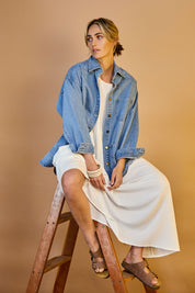 Model Tegan wearing size 10 of the Good Times Oversize Denim Jacket in colour Denim (Blue), from the front, showing the whole outfit