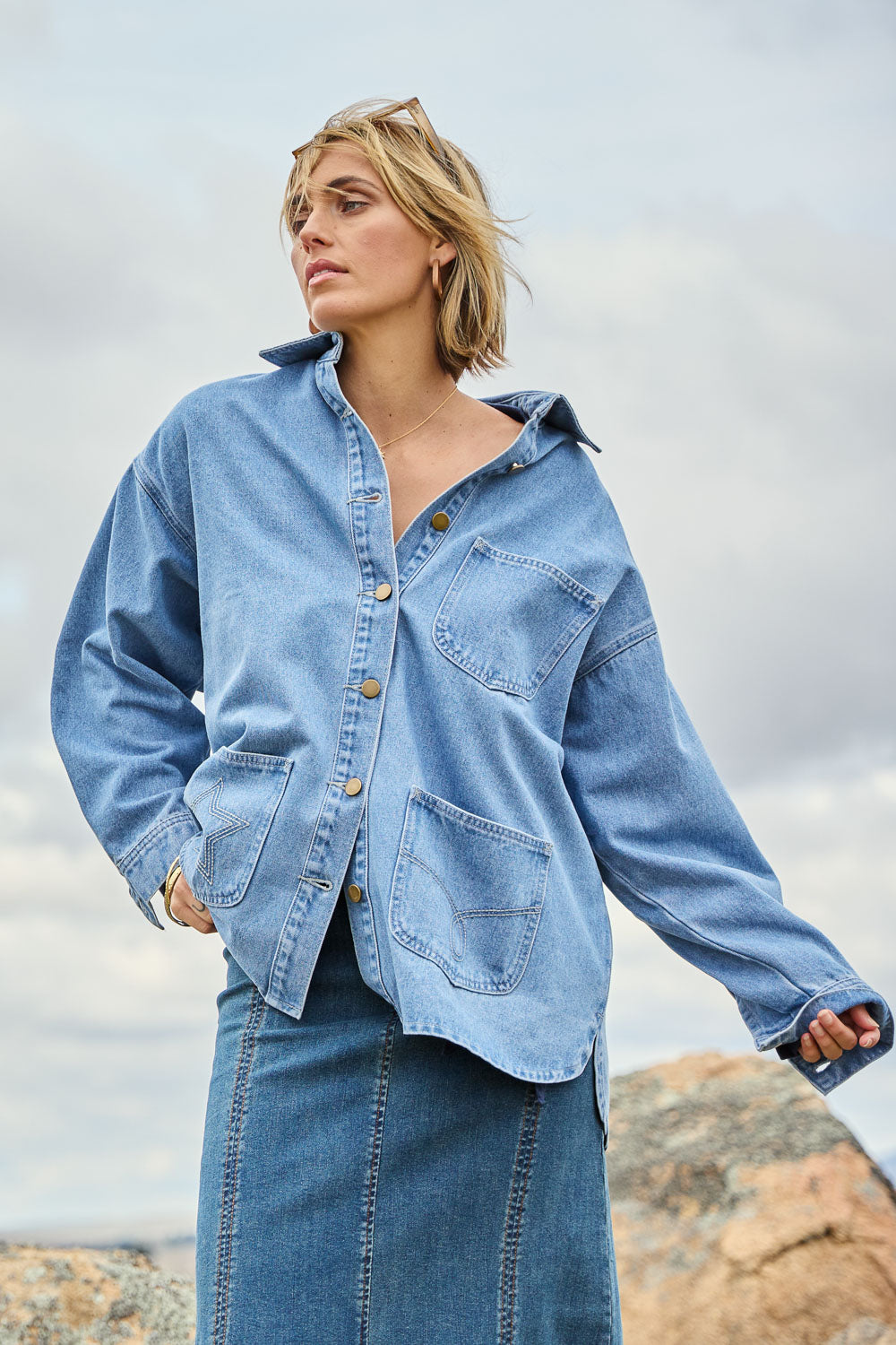 Model Tegan wearing size 10 of the Good Times Oversize Denim Jacket in colour Denim (Blue), from the front, showing the whole outfit