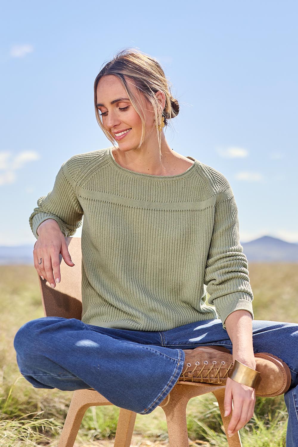 Model Tegan wearing size S of the Cover Me In Cotton Sweater in colour Sage (Green), from the front, showing the whole outfit