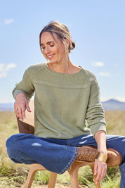 Model Tegan wearing size S of the Cover Me In Cotton Sweater in colour Sage (Green), from the front, showing the whole outfit
