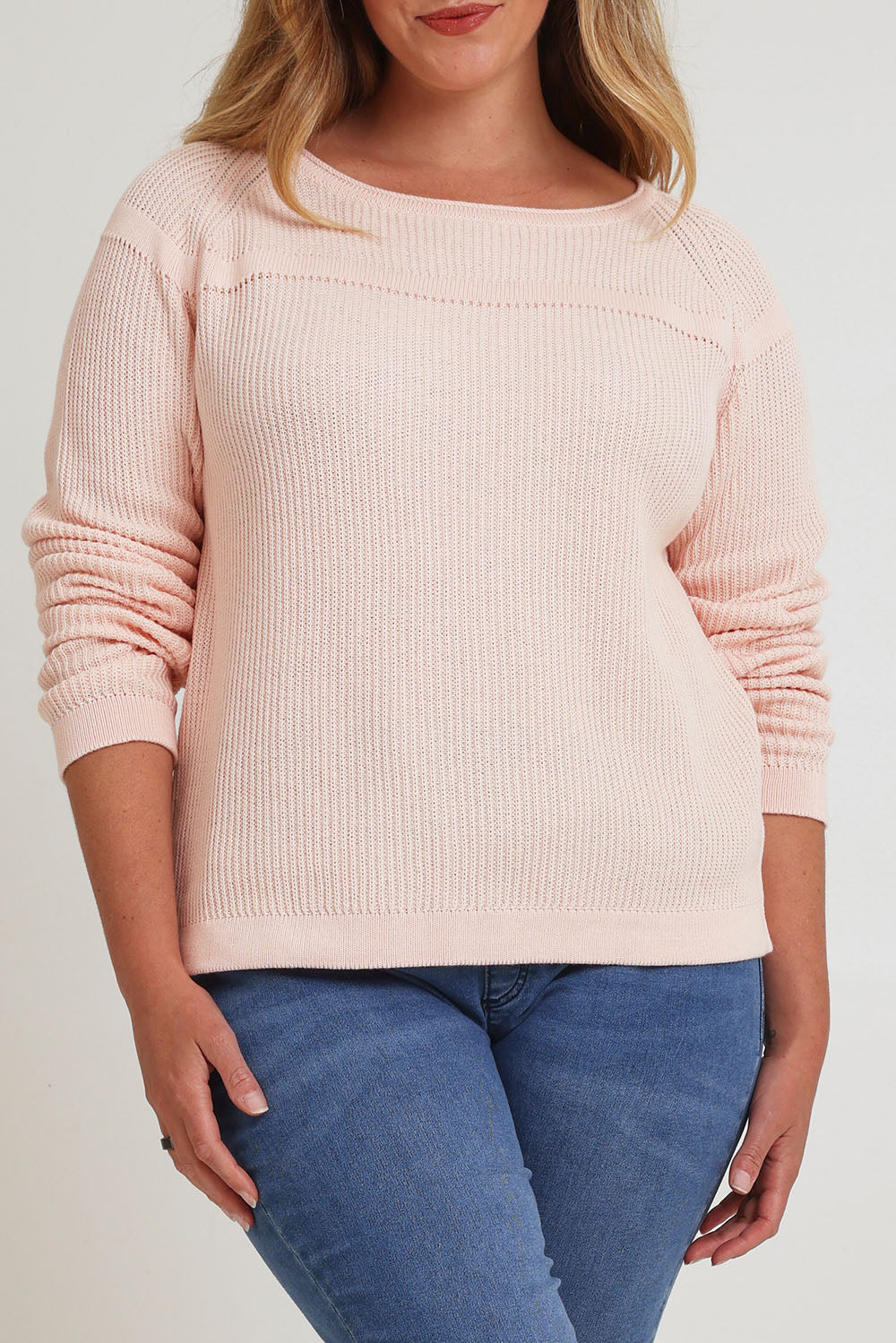 Model Chanel wearing size XL of the Cover Me In Cotton Sweater in colour Sherbet (Pink), from the front, cropped image