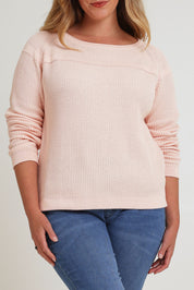 Model Chanel wearing size XL of the Cover Me In Cotton Sweater in colour Sherbet (Pink), from the front, cropped image