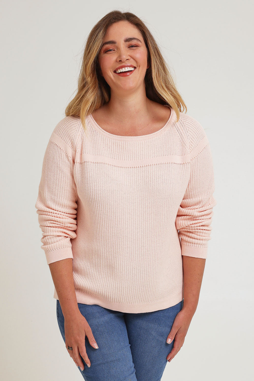 Model Chanel wearing size XL of the Cover Me In Cotton Sweater in colour Sherbet (Pink), from the front, cropped image