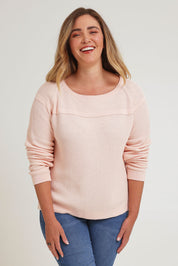 Model Chanel wearing size XL of the Cover Me In Cotton Sweater in colour Sherbet (Pink), from the front, cropped image