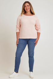 Model Chanel wearing size XL of the Cover Me In Cotton Sweater in colour Sherbet (Pink), from the front, showing the whole outfit