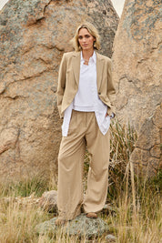 Model Tegan wearing size 10 of the Sweet Whispers High Waisted Pants in colour Sand, from the front, showing the whole outfit