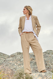 Model Tegan wearing size 10 of the Sweet Whispers High Waisted Pants in colour Sand, from the front, showing the whole outfit