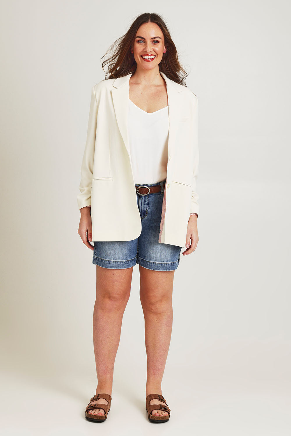 Model Jane wearing size 14 of the Elegant Persuasion Ruched Sleeved Oversized Blazer in colour Cream, from the front, showing the whole outfit