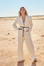 Model Tegan wearing size 10 of the Elegant Persuasion Ruched Sleeved Oversized Blazer in colour Cream, from the front, showing the whole outfit