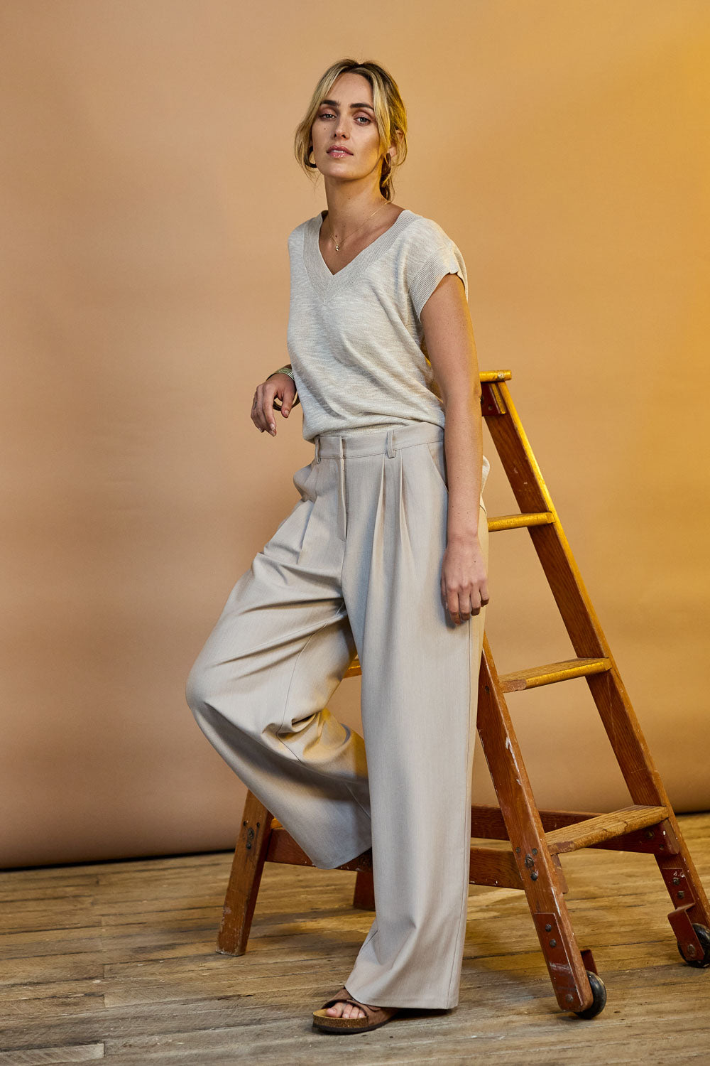 Model Tegan wearing size 10 of the Elegant Persuasion Pants in colour Bone, from the front, showing the whole outfit