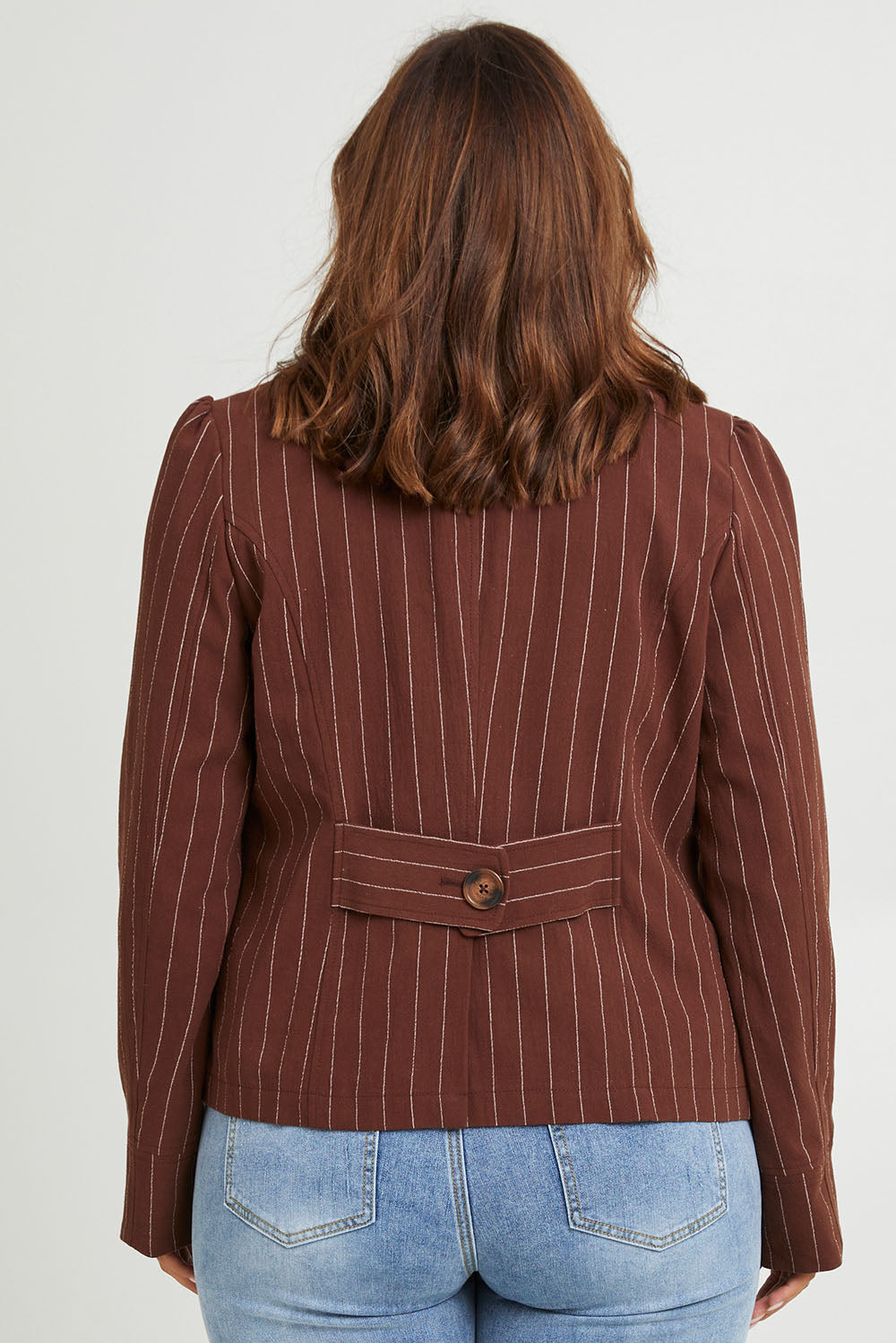Model Monique wearing size 14 of the Across The Fields Pinstripe Jacket in colour Chocolate, from the back