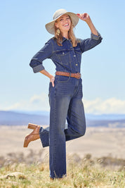 Model Katie wearing size 10 of the Denim Daze Jumpsuit in colour Darkdenim (Blue), from the front, showing the whole outfit