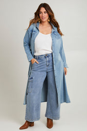 Model Laura wearing size 14 of the Wyatt Long Denim Dress in colour Denim (Blue), from the front, showing the whole outfit