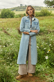 Model Tegan wearing size 10 of the Wyatt Long Denim Dress in colour Denim (Blue), from the front, showing the whole outfit
