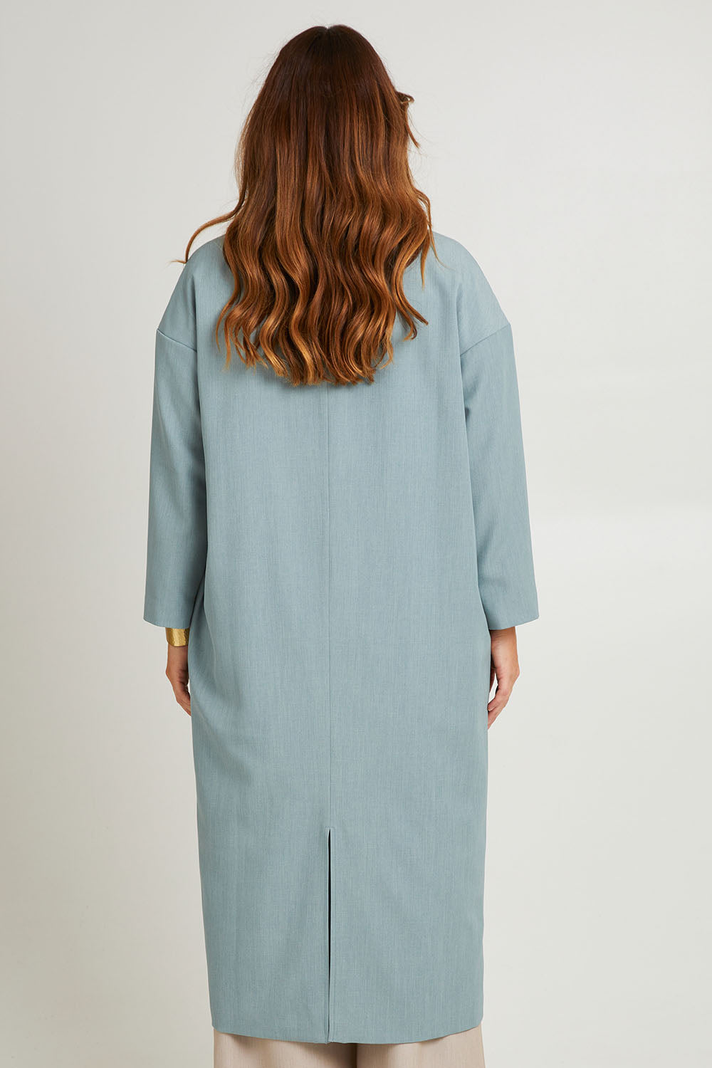 Model Laura wearing size 14 of the Suits Me Long Jacket in colour Dusk (Blue), from the back