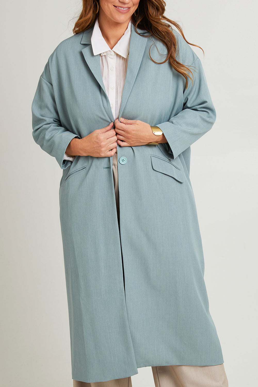 Model Laura wearing size 14 of the Suits Me Long Jacket in colour Dusk (Blue), from the front, cropped image