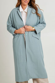 Model Laura wearing size 14 of the Suits Me Long Jacket in colour Dusk (Blue), from the front, cropped image