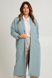 Model Laura wearing size 14 of the Suits Me Long Jacket in colour Dusk (Blue), from the front, cropped image
