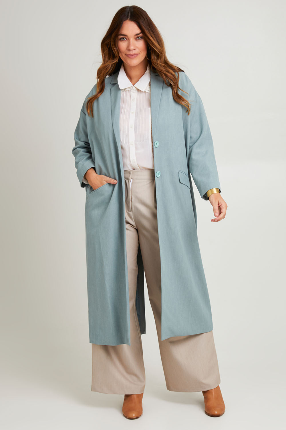 Model Laura wearing size 14 of the Suits Me Long Jacket in colour Dusk (Blue), from the front, showing the whole outfit