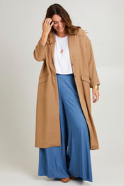 Model Laura wearing size 14 of the Suits Me Long Jacket in colour Earth, from the front, showing the whole outfit