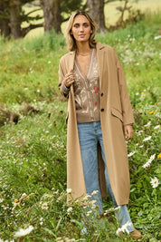 Model Tegan wearing size 10 of the Suits Me Long Jacket in colour Earth, from the front, showing the whole outfit