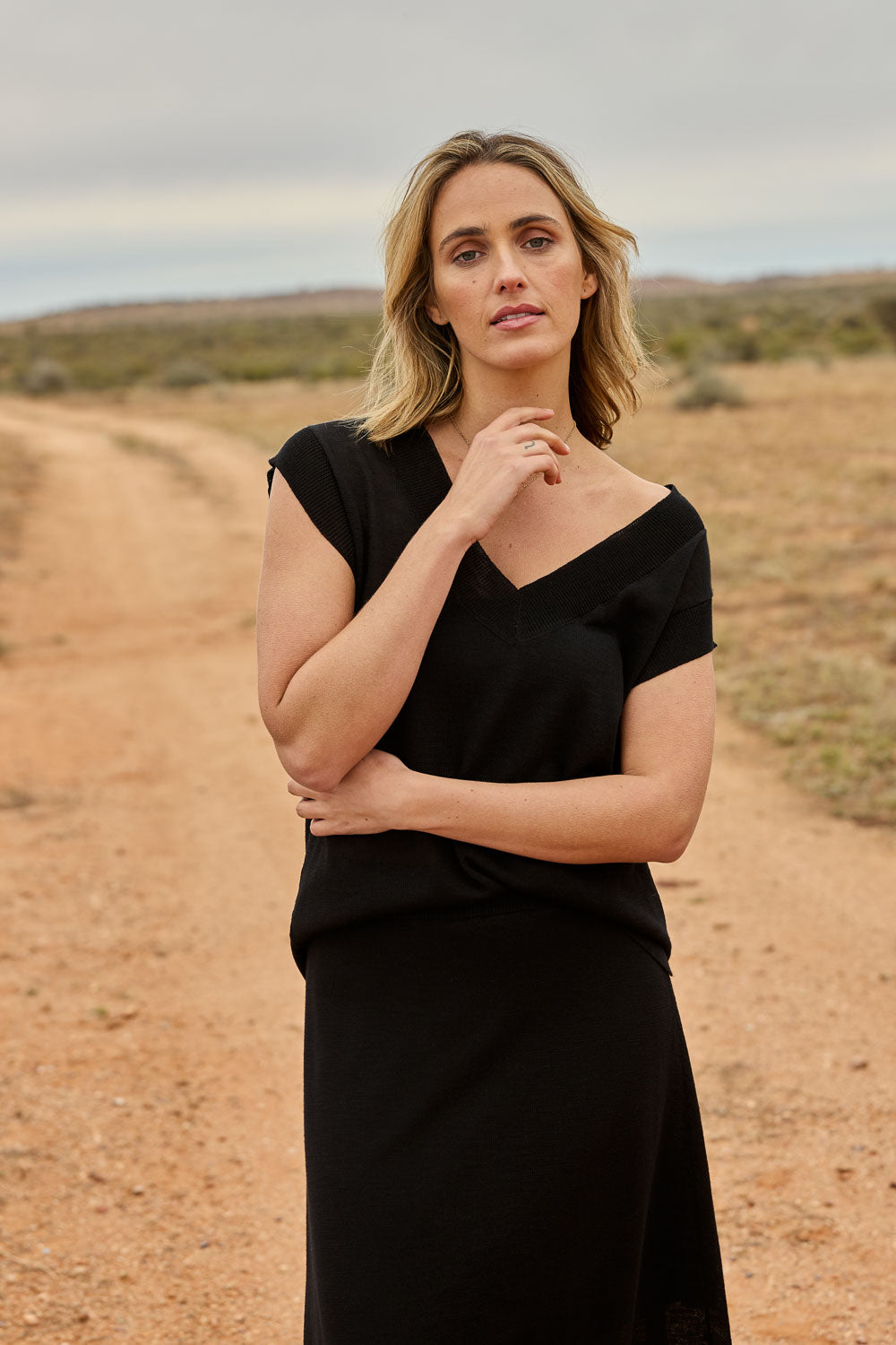 Model Tegan wearing size S of the Go To Knit Tank in colour Black (Black), from the front, showing the whole outfit