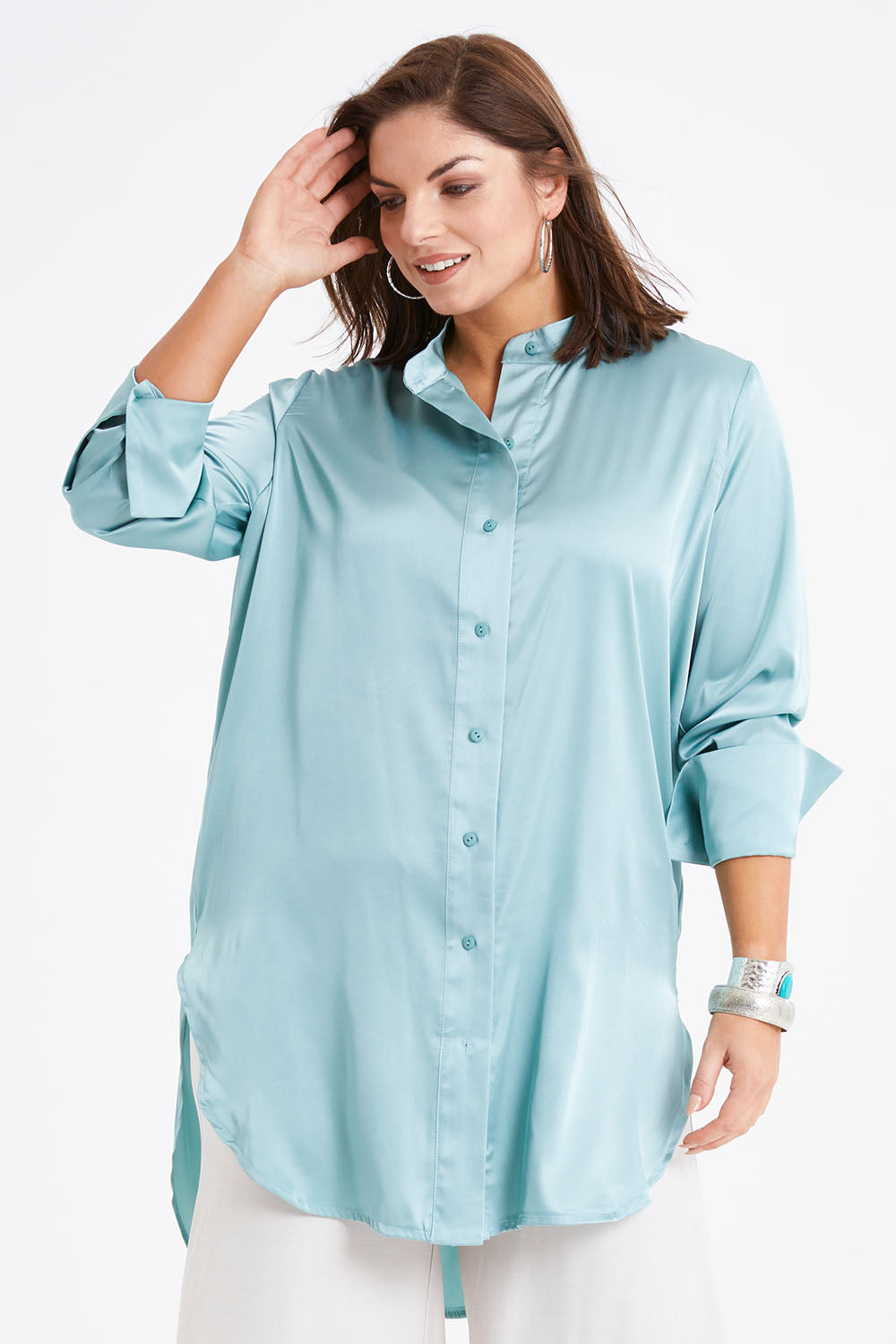 Model Monique wearing size 14 of the Going With The Flow Tunic Blouse in colour Sage (Green), from the front, cropped image