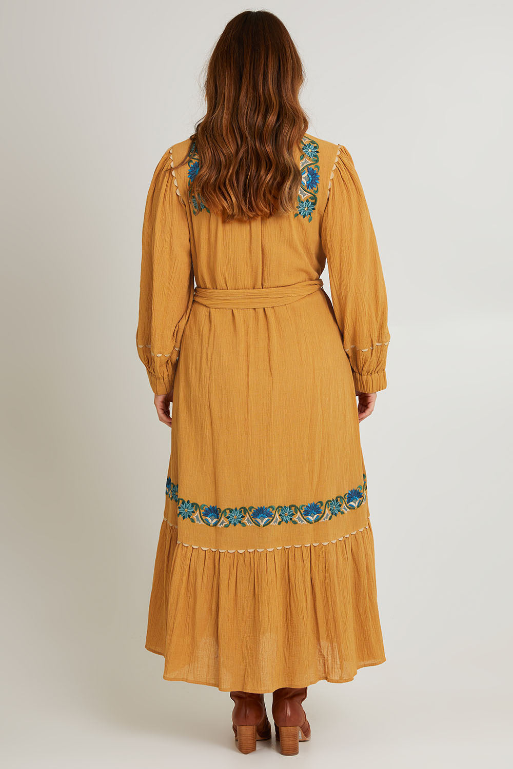 Model Laura wearing size 14 of the Say You Love Me Maxi Dress in colour Clay, from the back