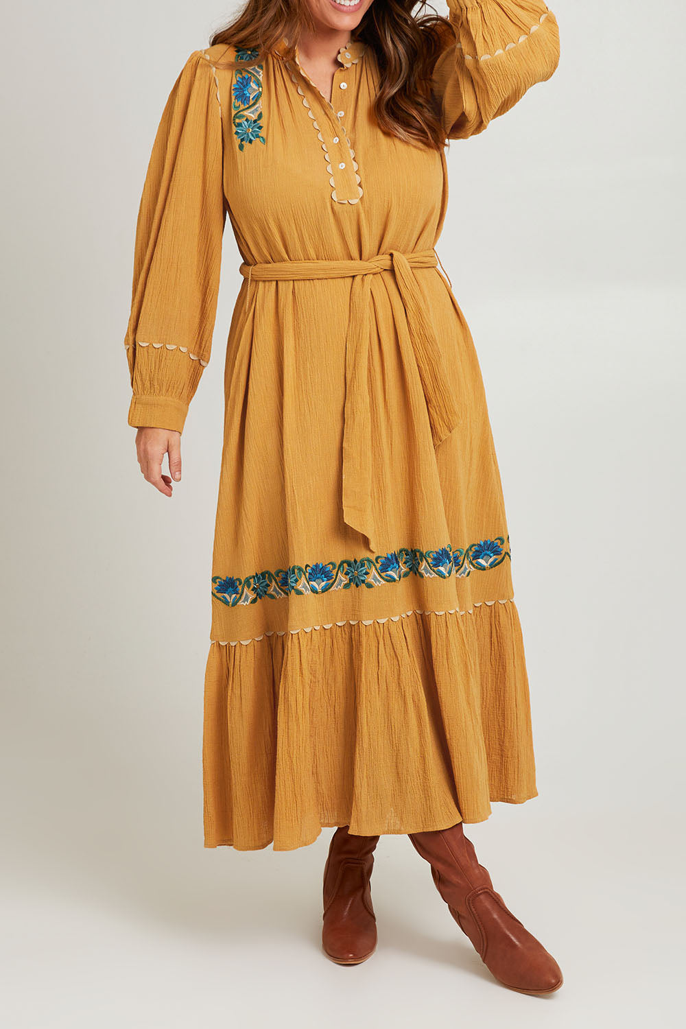 Model Laura wearing size 14 of the Say You Love Me Maxi Dress in colour Clay, from the front, cropped image