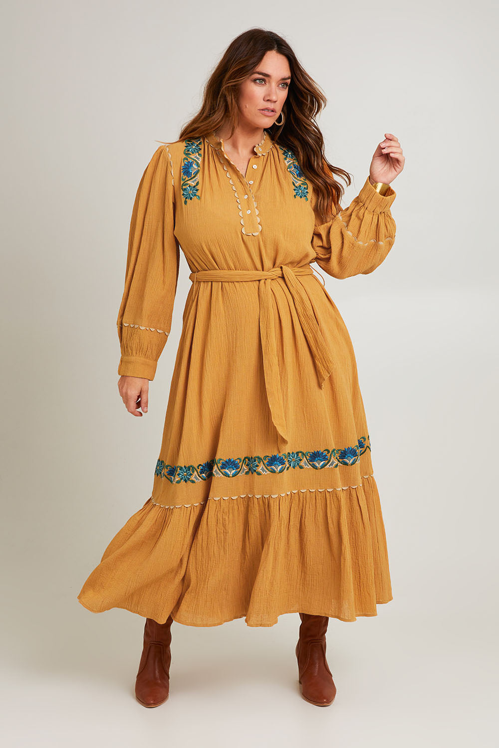 Model Laura wearing size 14 of the Say You Love Me Maxi Dress in colour Clay, from the front, showing the whole outfit