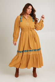 Model Laura wearing size 14 of the Say You Love Me Maxi Dress in colour Clay, from the front, showing the whole outfit