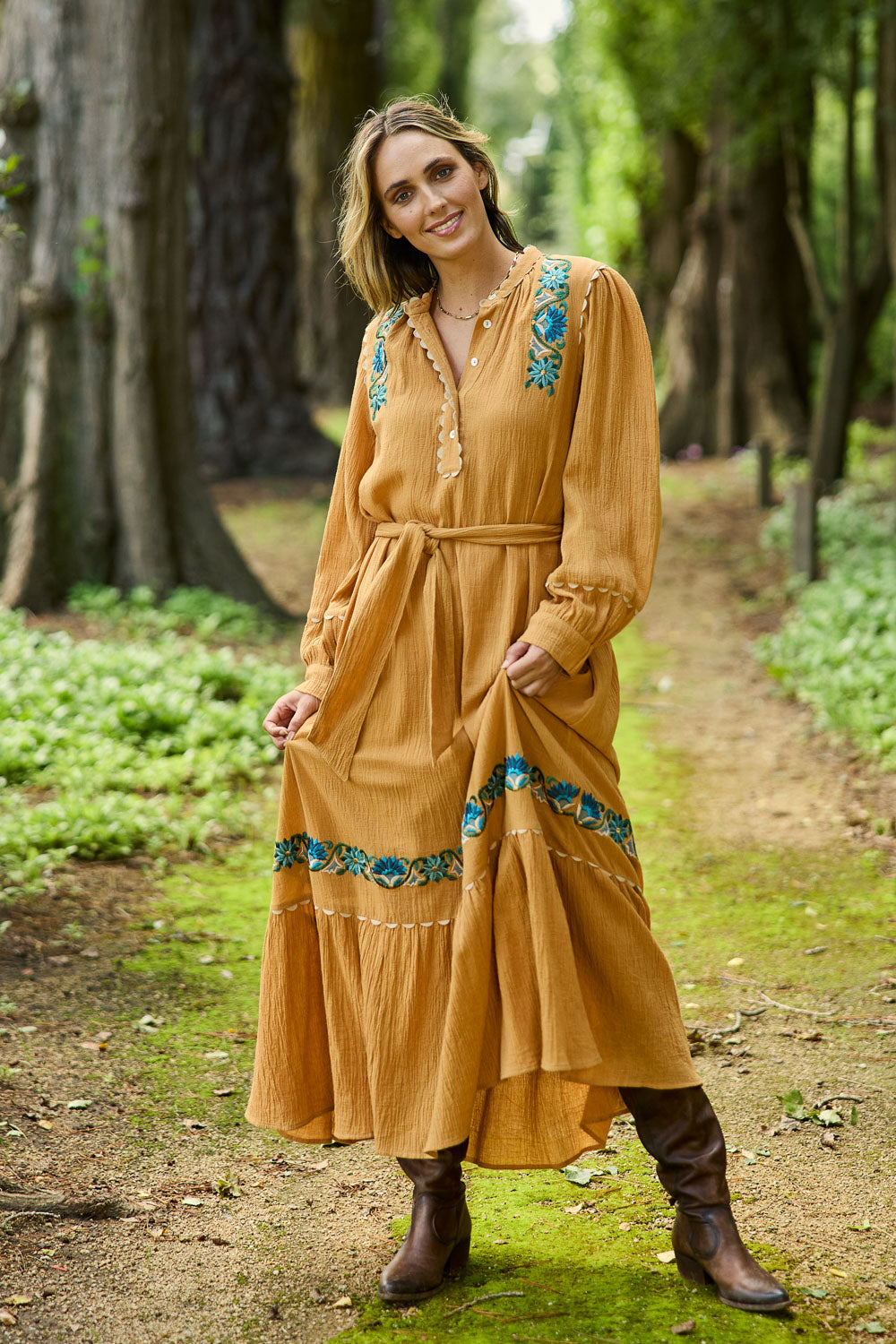 Model Tegan wearing size 10 of the Say You Love Me Maxi Dress in colour Clay, from the front, showing the whole outfit