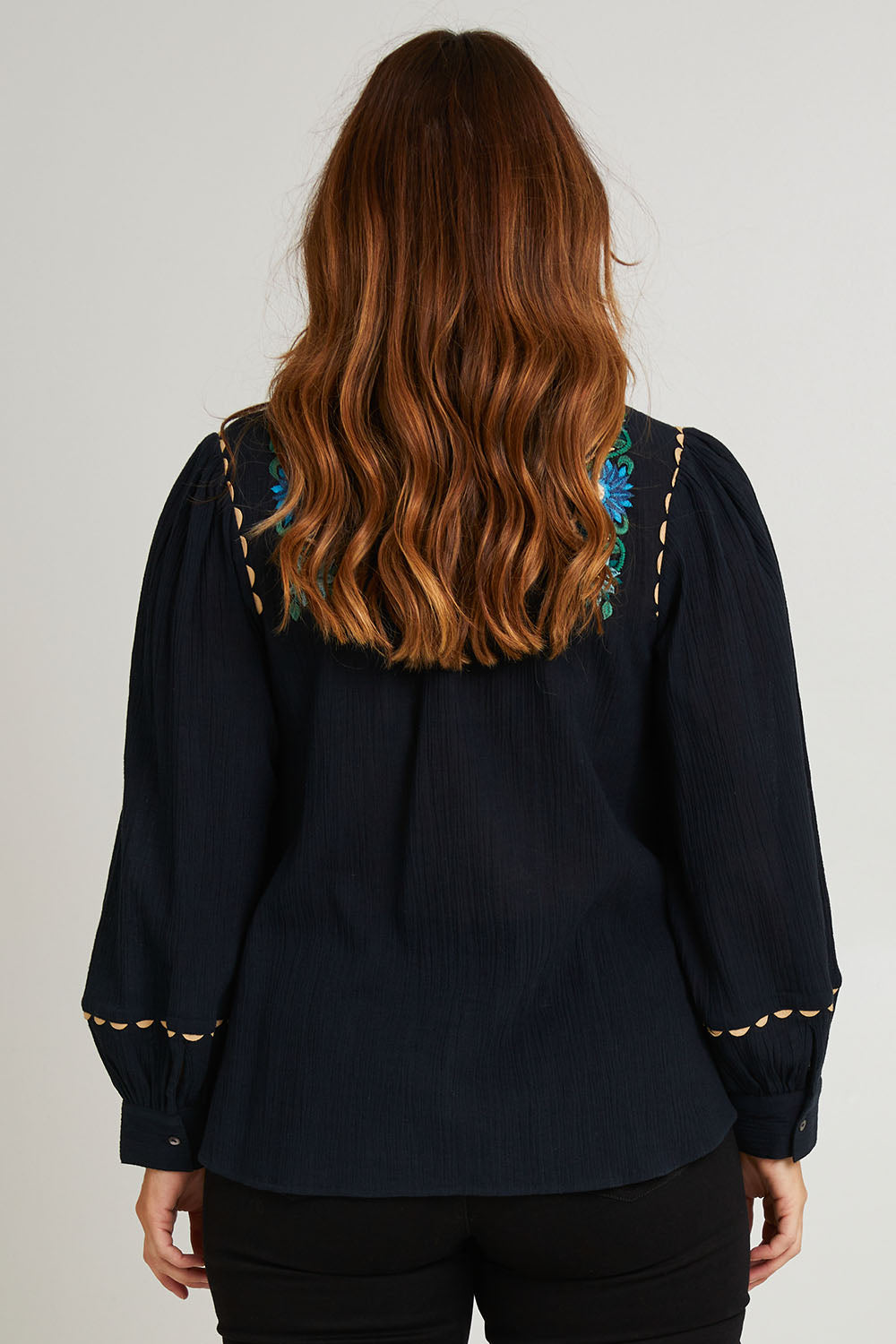 Model Laura wearing size 14 of the Say You Love Me Blouse in colour Black (Black), from the back