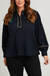 Model Laura wearing size 14 of the Say You Love Me Blouse in colour Black (Black), from the front, cropped image