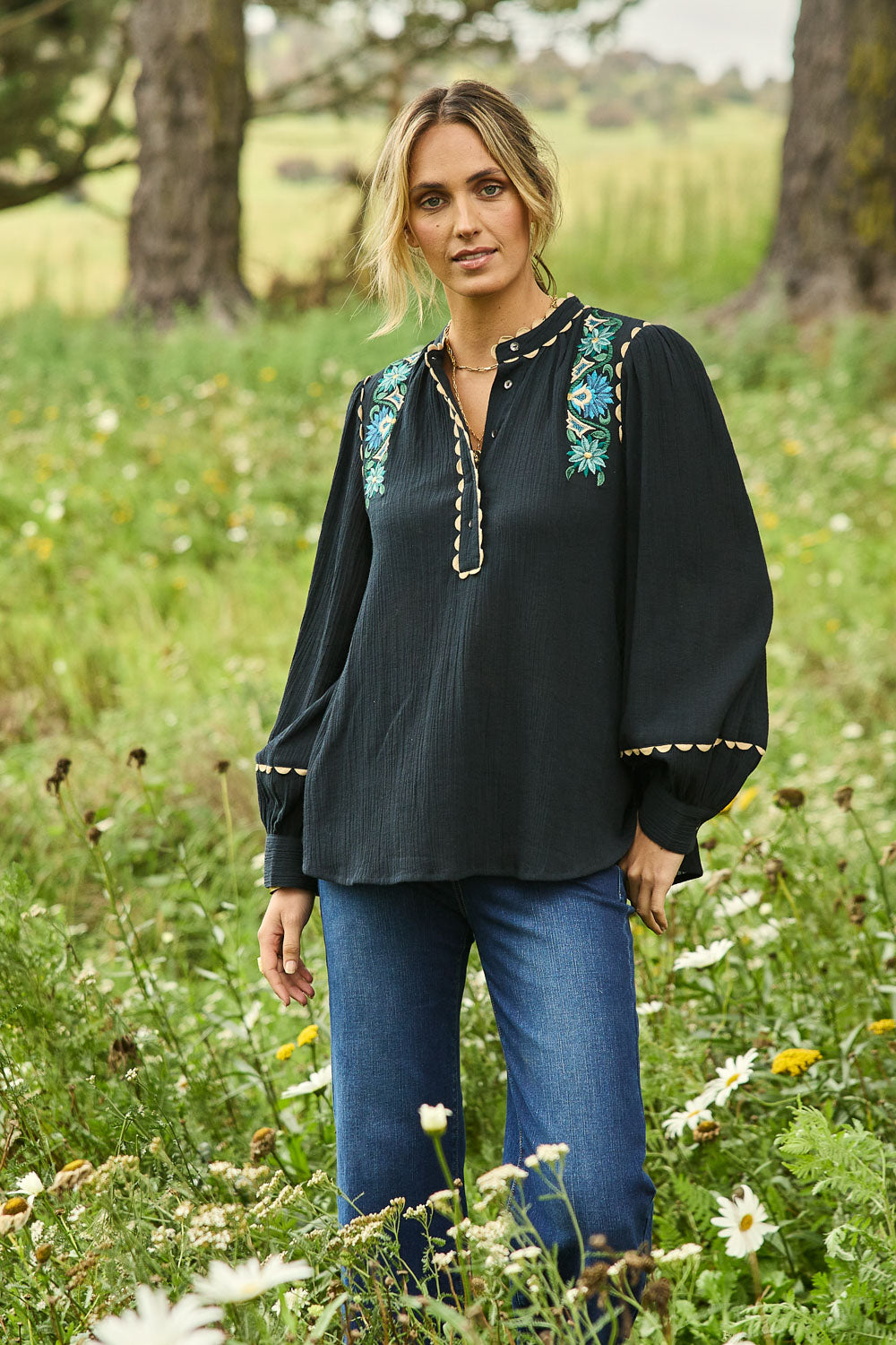 Model Tegan wearing size 10 of the Say You Love Me Blouse in colour Black (Black), from the front, showing the whole outfit