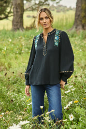 Model Tegan wearing size 10 of the Say You Love Me Blouse in colour Black (Black), from the front, showing the whole outfit