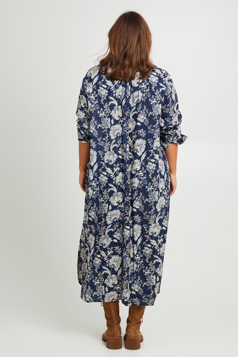 Model Monique wearing size 14 of the Swept Away By You Duster Blouse in colour Bluefleur (Blue), from the back
