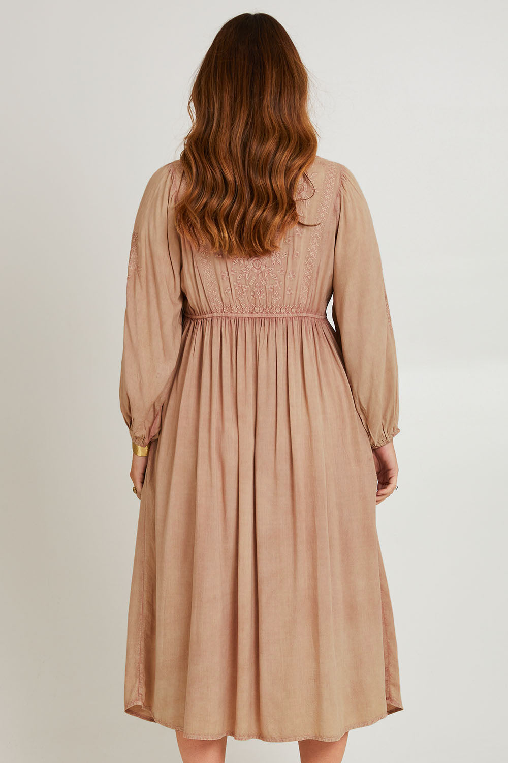 Model Laura wearing size 14 of the Through The Fields Dress in colour Dust, from the back