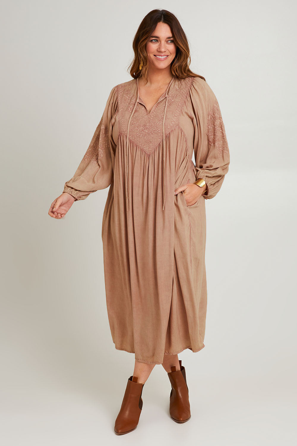 Model Laura wearing size 14 of the Through The Fields Dress in colour Dust, from the front, showing the whole outfit