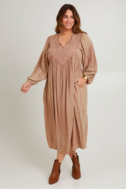 Model Laura wearing size 14 of the Through The Fields Dress in colour Dust, from the front, showing the whole outfit