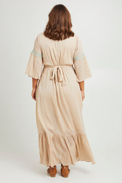 Model Monique wearing size 14 of the Perfect As You Are Maxi Dress in colour Sand, from the back